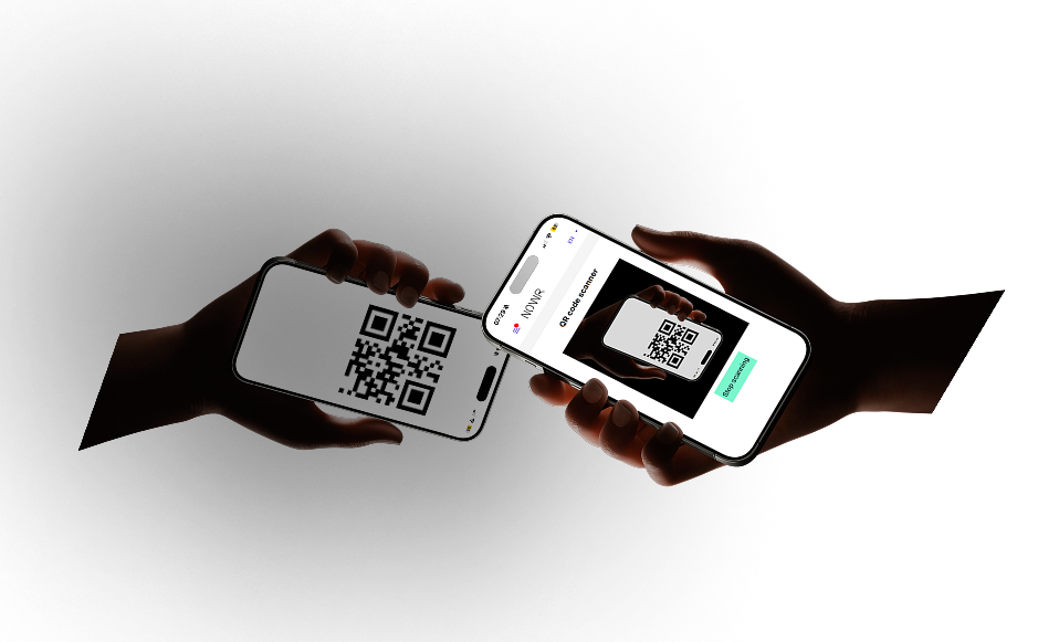 Hands with phones showing QR codes